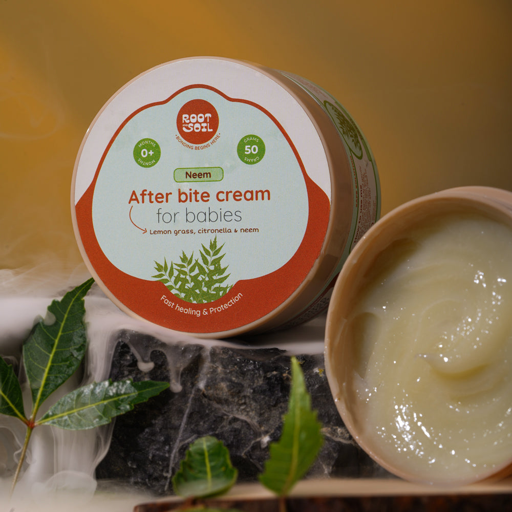 After-bite cream for babies with a visible container and open lid on a natural background.